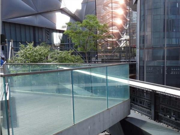Enhanced Effective Thickness Method for Cantilevered Laminated Glass Balustrades